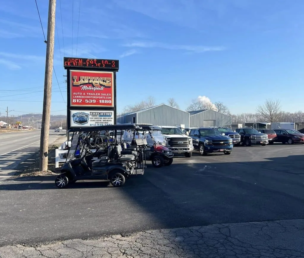 the outside of lawrence motorsports, an auto and trailer dealership in Aurora, IN